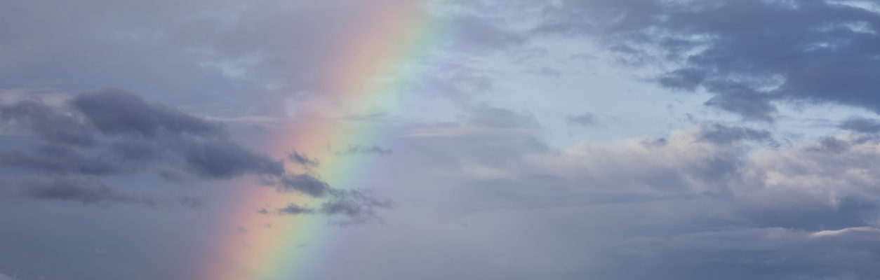 rainbow in a cloudy sky