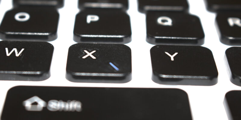 Computer Keys Keyboard Scattered on White Background