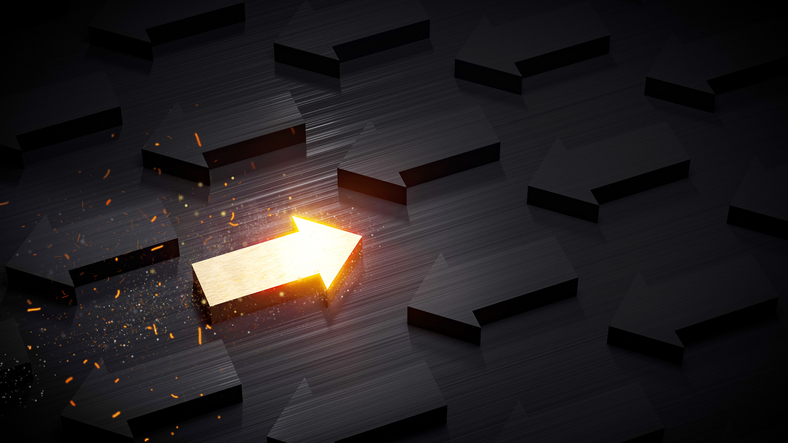 A golden arrow going against the trend of other dark arrows.